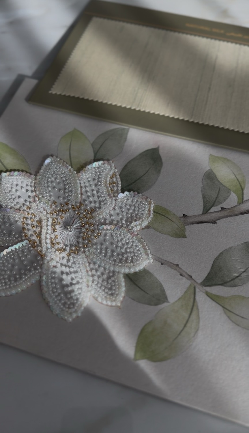 Hand-embroidered magnolia on hand-painted natural silk by Radius